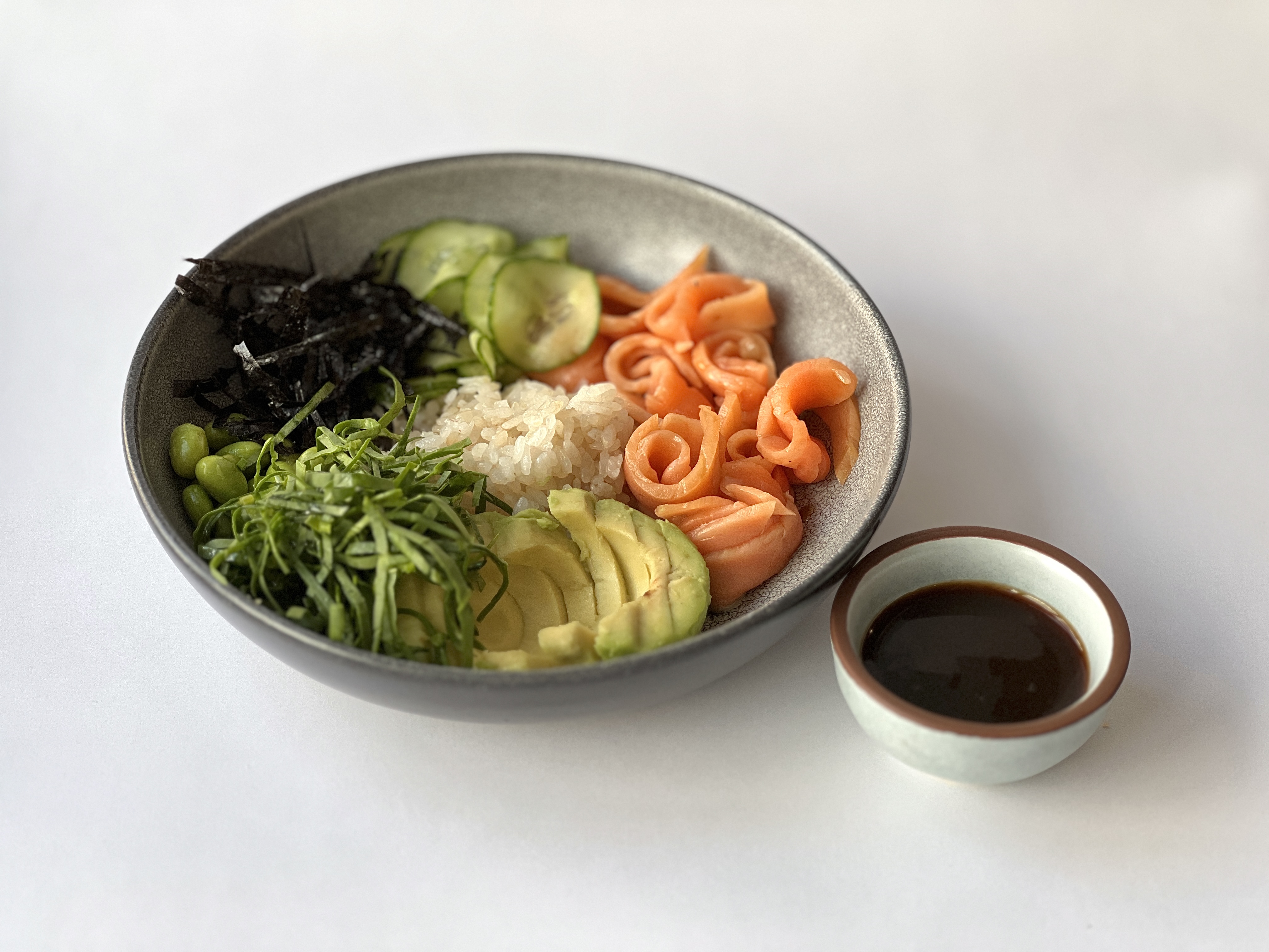 Lightly salted trout, avocado, ginger cucumber, nori,<br>rice, spinach<br><br>