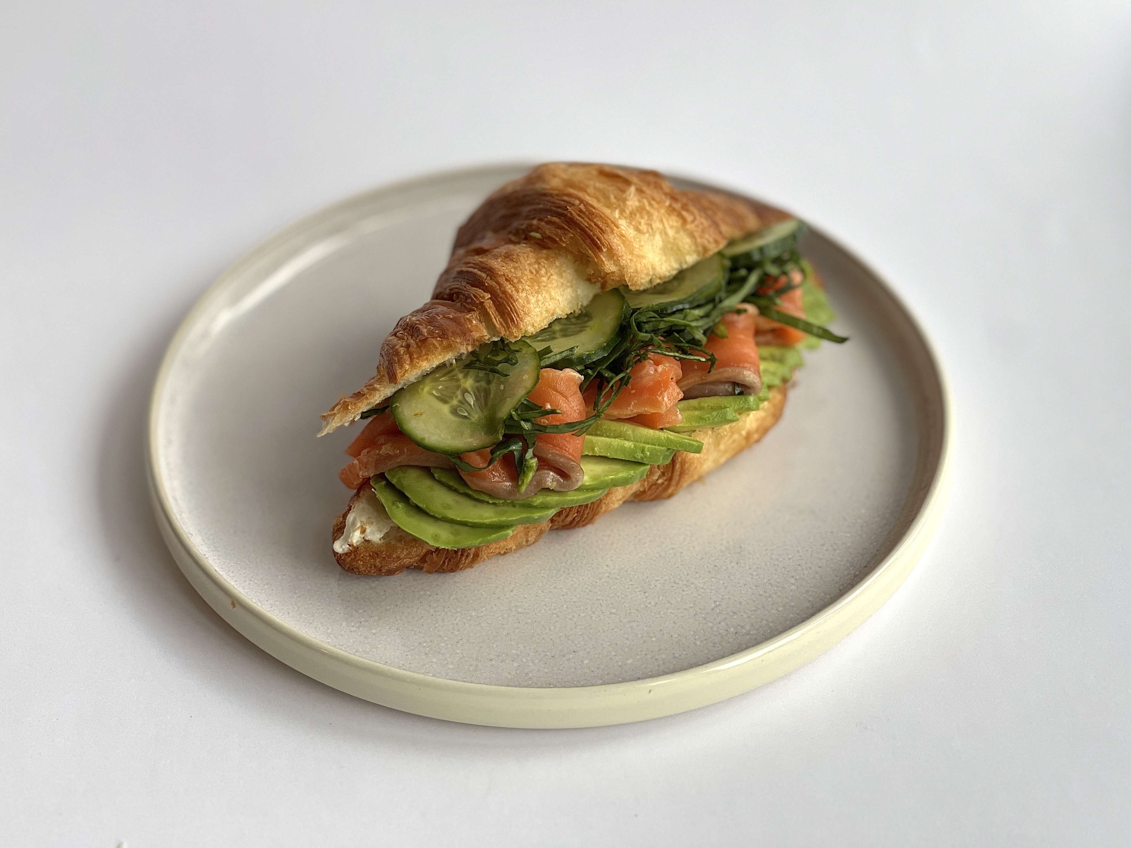 Croissant, salmon, avocado, ginger cucumber, spinach<br><br>