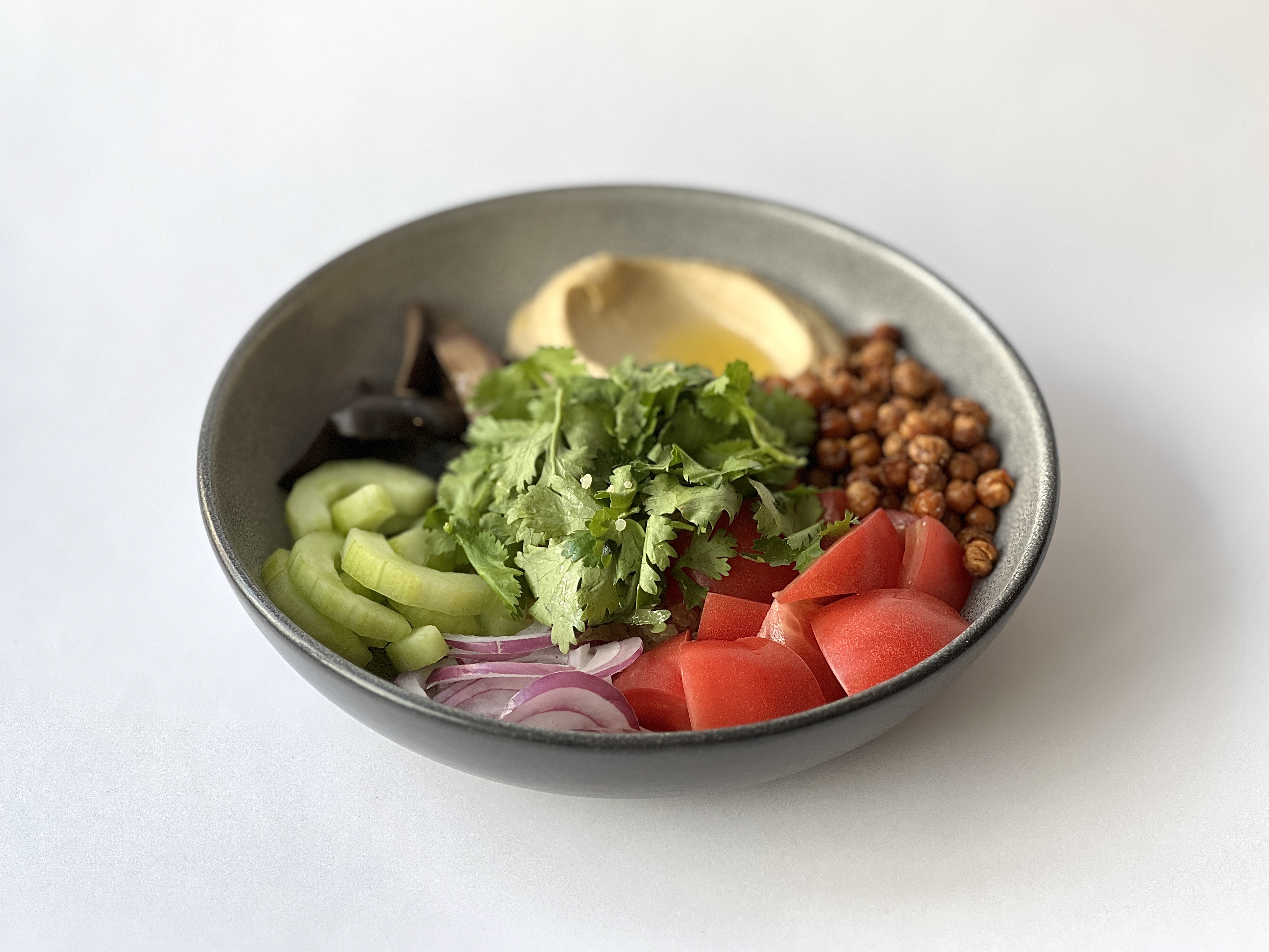 Hummus, roasted chickpeas, pink tomatoes, red onion,<br>olives, quinoa, cucumbers<br><br>